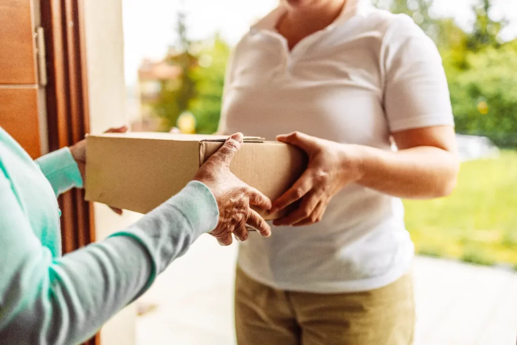 delivery-staff-carrying-paper-boxes-shop-online-a-2026-03-24-06-26-39-utc