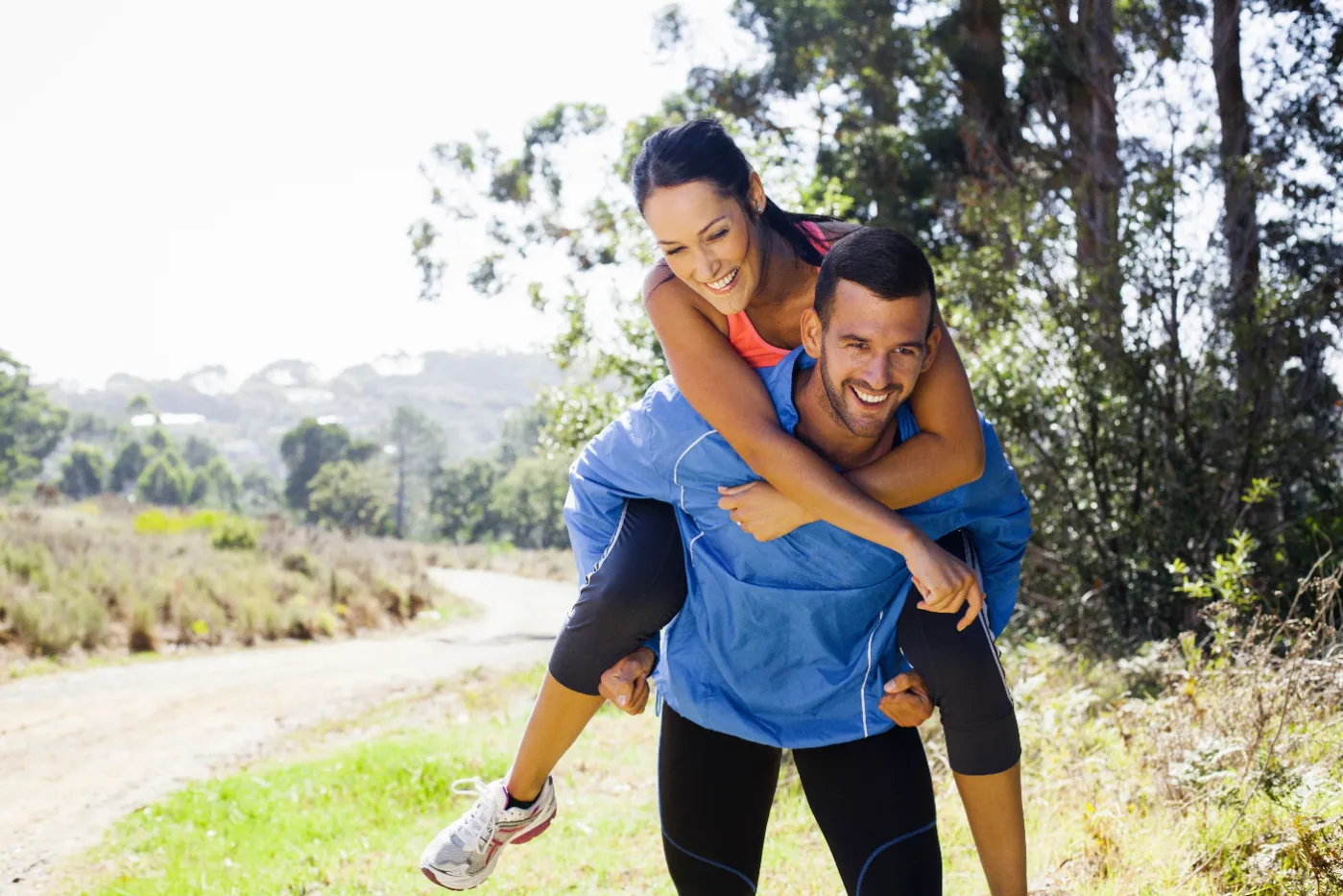 female-jogger-riding-piggyback-on-man-2026-03-26-11-53-07-utc